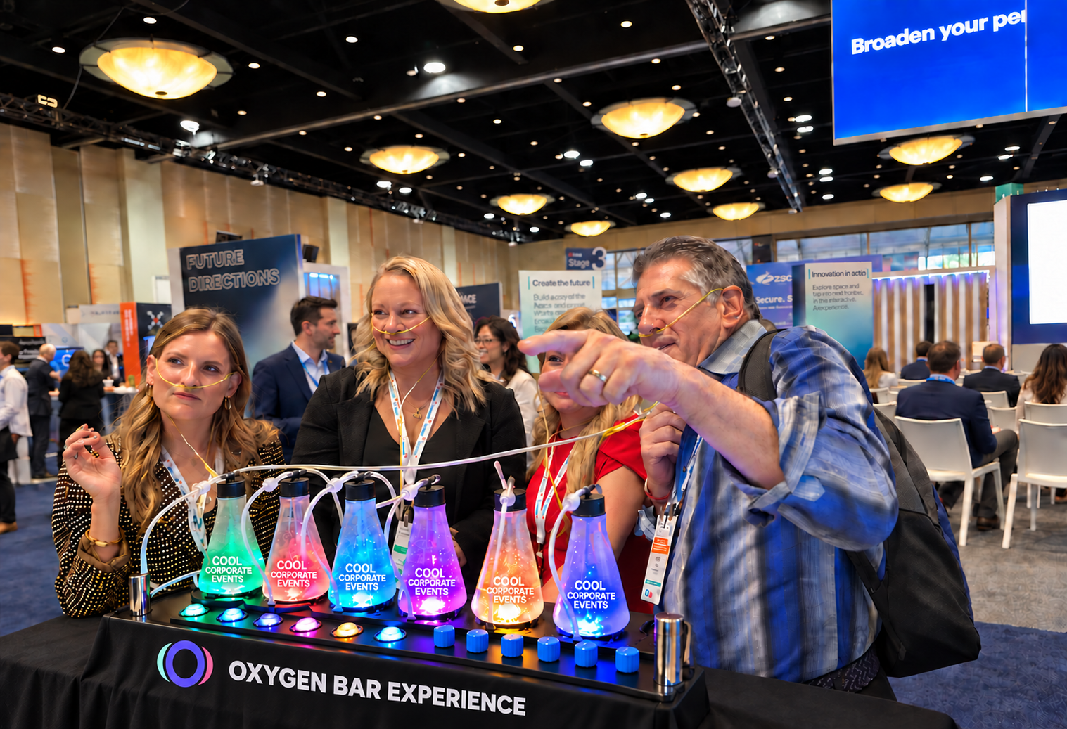 Conference guests using an illuminated oxygen bar together on a busy trade-show floor