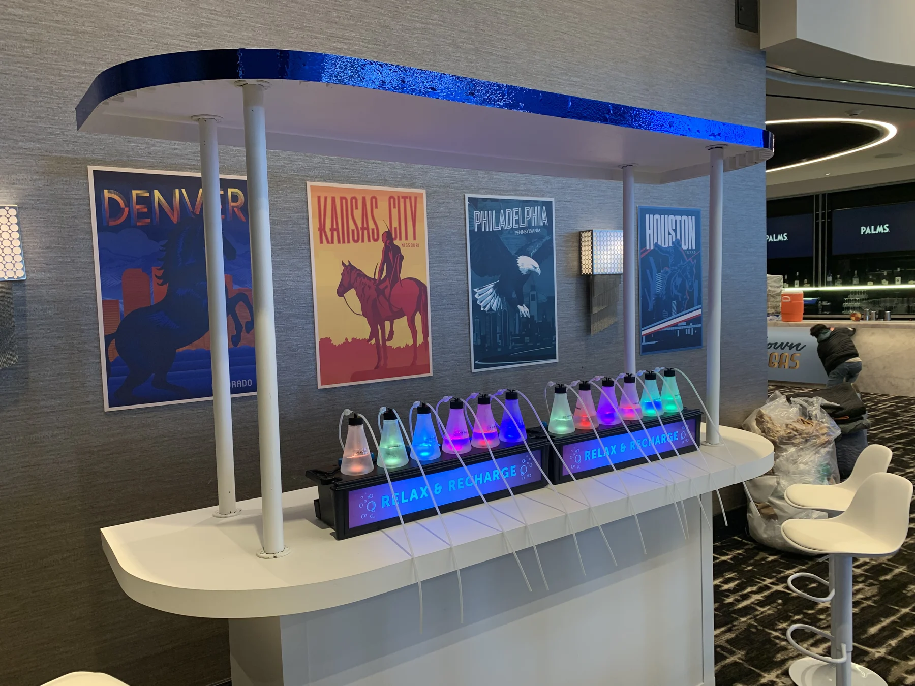 An oxygen bar beneath a canopy with destination posters